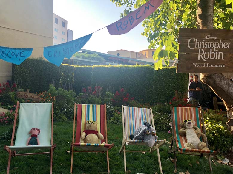 Winnie the Pooh characters sunbathing on the red carpet