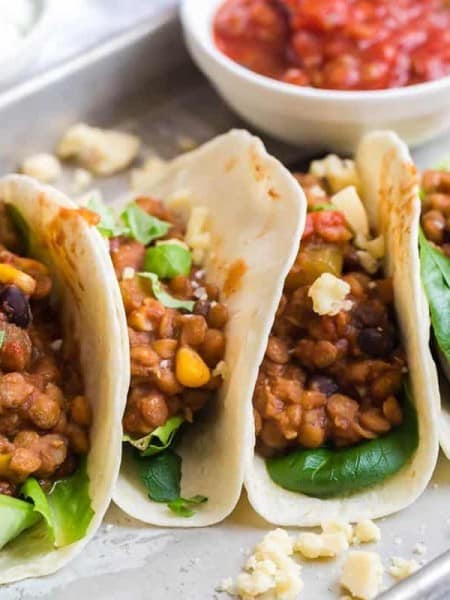 prepared lentil tacos on a white plate