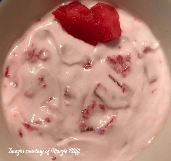 bowl of greek yogurt with watermelon chopped up and mixed in