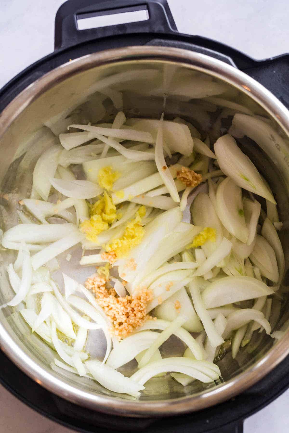 onions, garlic, and ginger in the instant pot