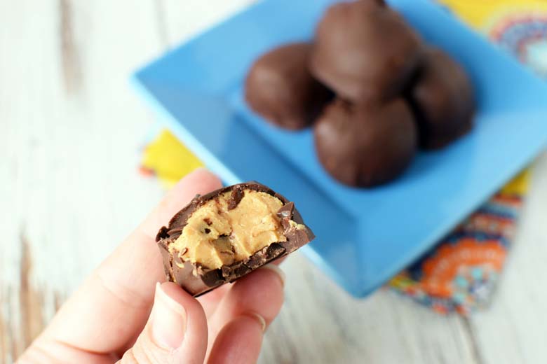 hand holding peanut butter balls