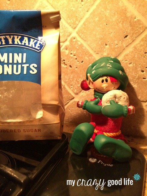 elf on the shelf eating powder donuts