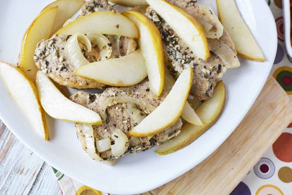 Easy Crockpot Pork Chops with Pears on white plate