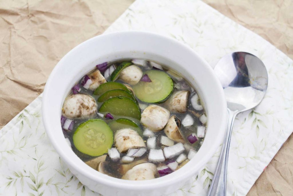 chicken bone broth in a white bowl