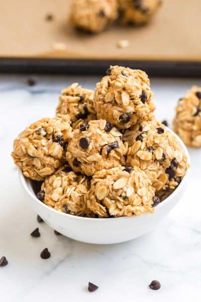 White bowl filled with peanut butter protein bites.