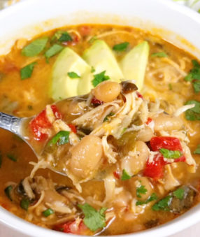 Healthy and Creamy White Chicken Chili with Greek Yogurt can be made in the crockpot, Instant Pot, or on the stove! If you're looking for an easy clean eating recipe, you've found one! This spicy chili recipe uses jalapenos and poblano peppers and is perfect for your holiday grazing table! 21 Day Fix Chili | 2B Mindset Chili | Portion Fix Chili | Healthy Chili Recipe #21dayfix #2bmindset #beachbody #chili