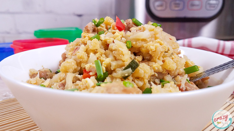 close up of cauliflower fried rice in a white bowl