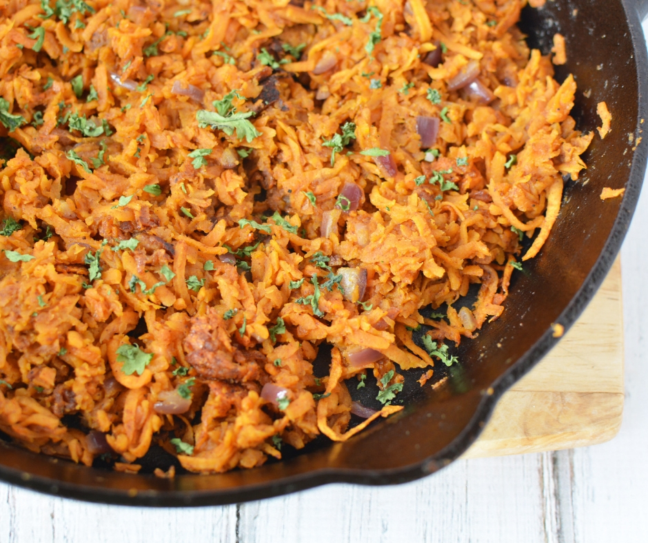 sweet potato hash browns in a cast iron skillet