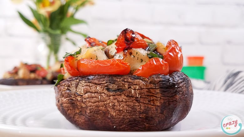 These Caprese Chicken Stuffed Portobello Mushrooms are a delicious lunch or dinner! A large portobello mushroom topped with a caprese chicken inspired mixture can be easily baked for a healthy dinner. I love how hearty and versatile portobello mushrooms are! Stuffed Portobello Mushroom Recipes | Mushroom Recipes | Portobello Recipes