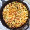 zucchini sausage casserole in a cast iron skillet