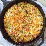 zucchini sausage casserole in a cast iron skillet