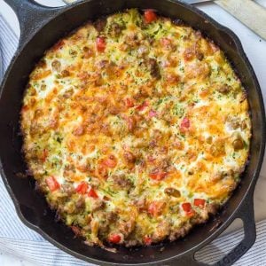 zucchini sausage casserole in a cast iron skillet