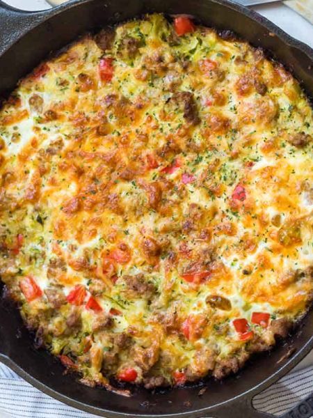 zucchini sausage casserole in a cast iron skillet