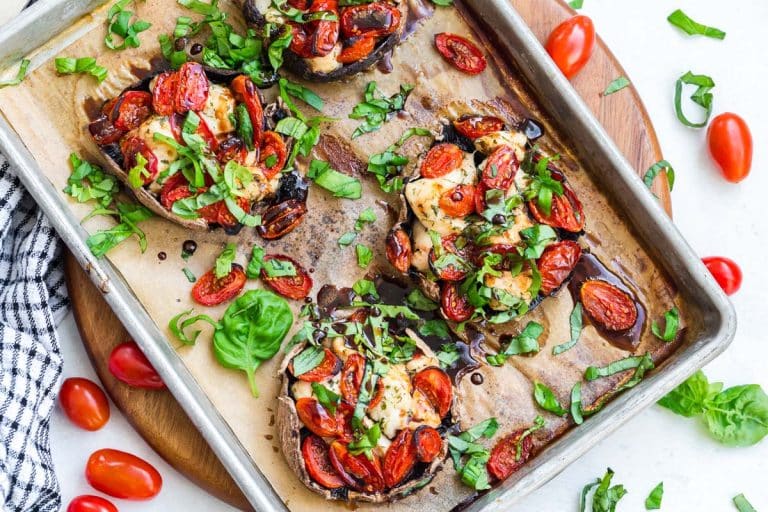 Four portobello mushrooms cooked with chicken and tomatoes and topped with fresh basil and a balsamic reduction.