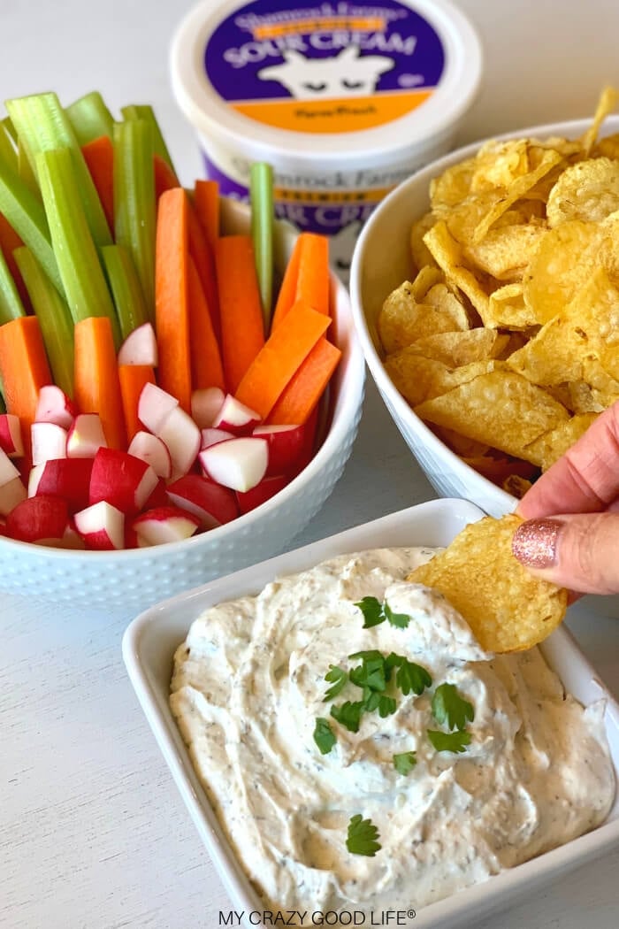 ranch crack dip in a white bowl with chip dip