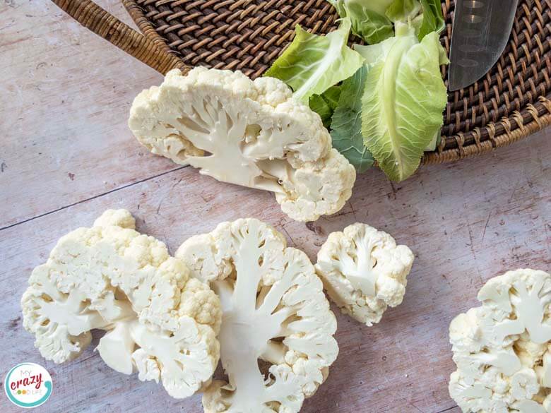 images of raw cauliflower cut into steaks