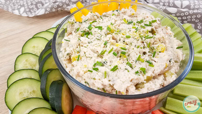 close up of dill pickle chicken dip in a clear bowl