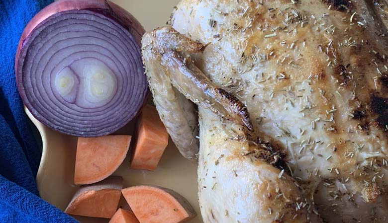 oven baked rotisserie chicken on yellow tray