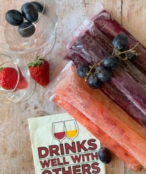 wine popsicles on a wood background