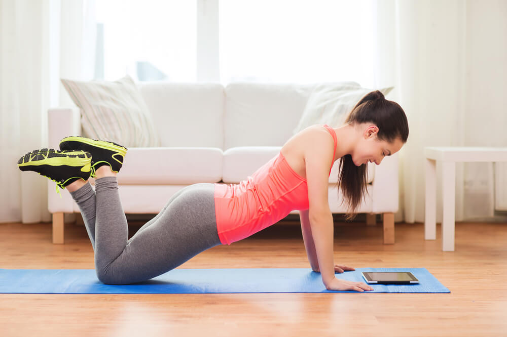 Woman doing yoga at home.