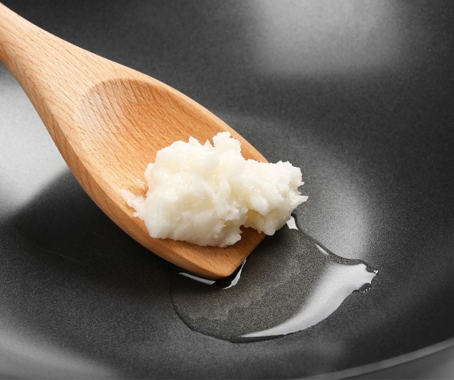 coconut oil in a pan being used for cooking.