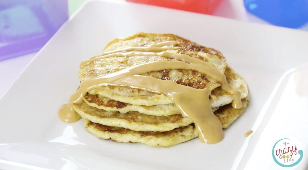 banana pancakes shown with peanut butter topping.