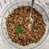 top down image of clear bowl with quinoa and brown rice