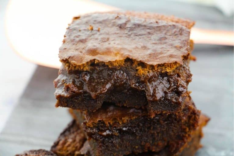 A stack of cut espresso brownies showing a gooey center.