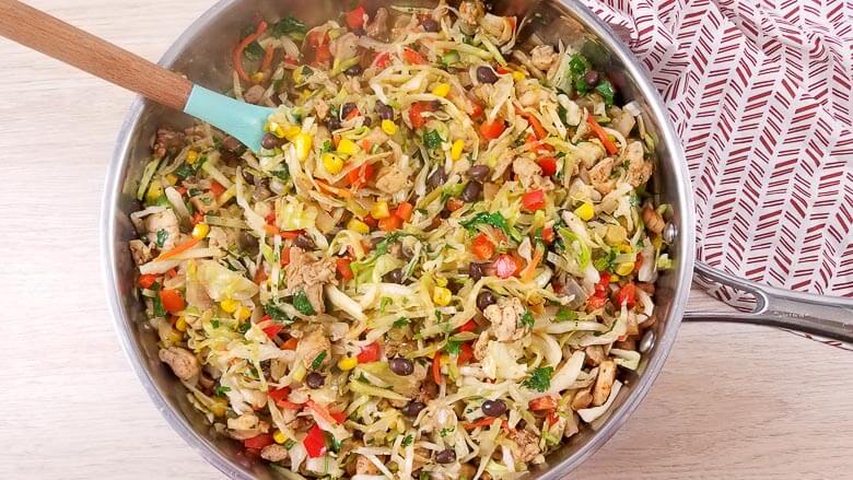 top down view of the egg roll in a bowl recipe cooking in a pan.