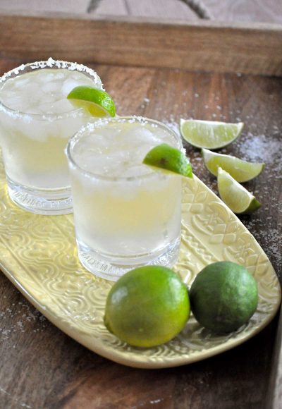 Two norcal margaritas sit on gold platter.