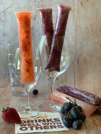 wine glasses with wine popsicles sitting inside.