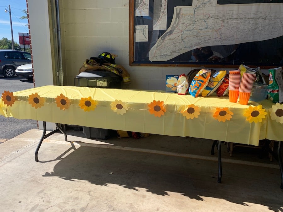 garland on a table with snacks and drinks.