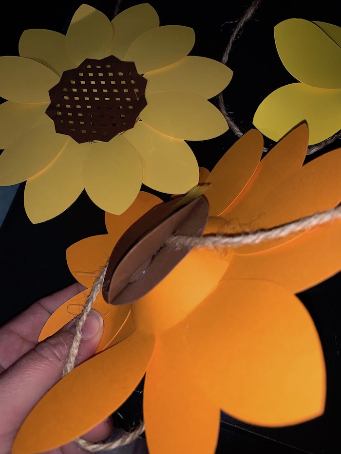 sunflower attached to twine with two circles as we compare cricut maker vs cricut explore air 2