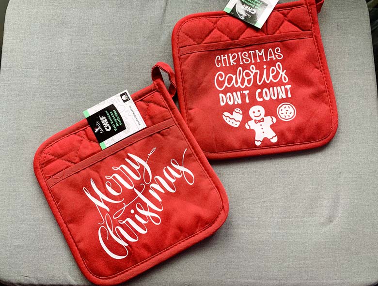 image of red potholders with Christmas phrases