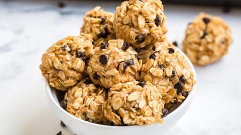 white bowl with ready to eat protein balls stacked inside.