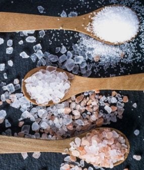 Salts on wooden spoons laid out and ready to be used.