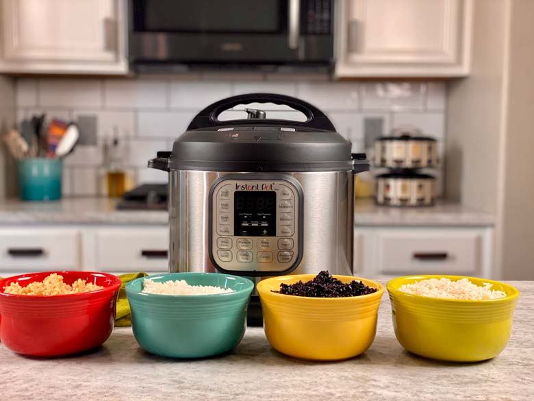 image of Instant Pot on counter with four bowls of different rice in front