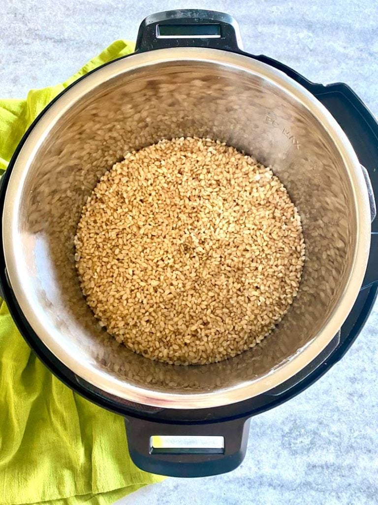 top down image of cooked brown rice in instant pot