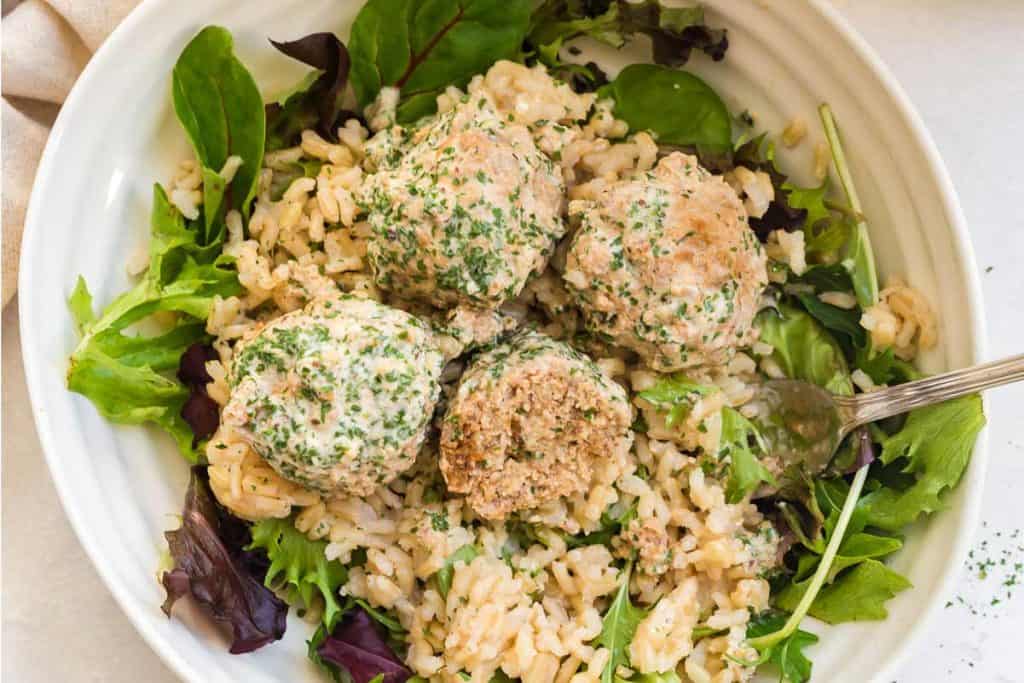close up of turkey swedish meatballs with rice and greens