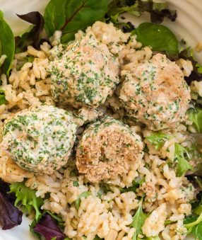 close up of turkey swedish meatballs with rice and greens