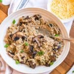 white plate with chicken mushroom risotto