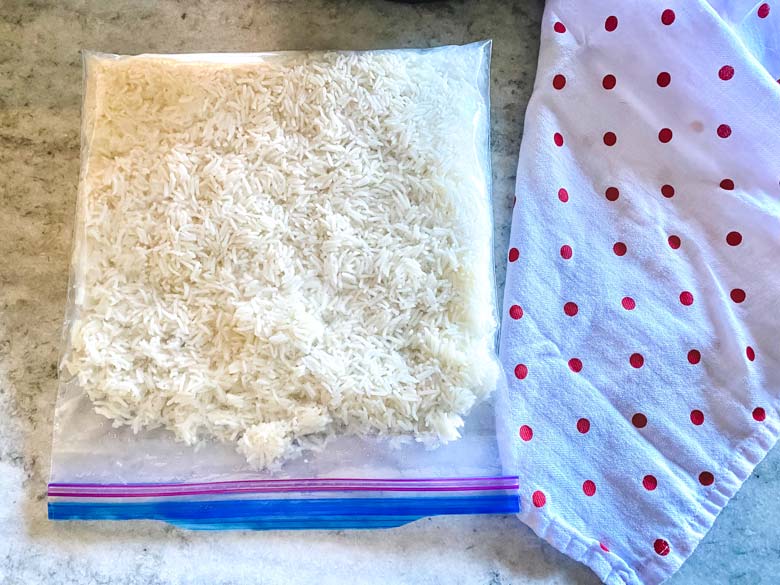 white rice in zipper bag on counter with red polka dot towel