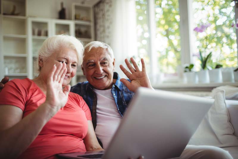 grandparents waving to the computer