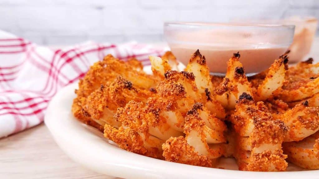 Baked Blooming Onion with Spicy Dipping Sauce close up