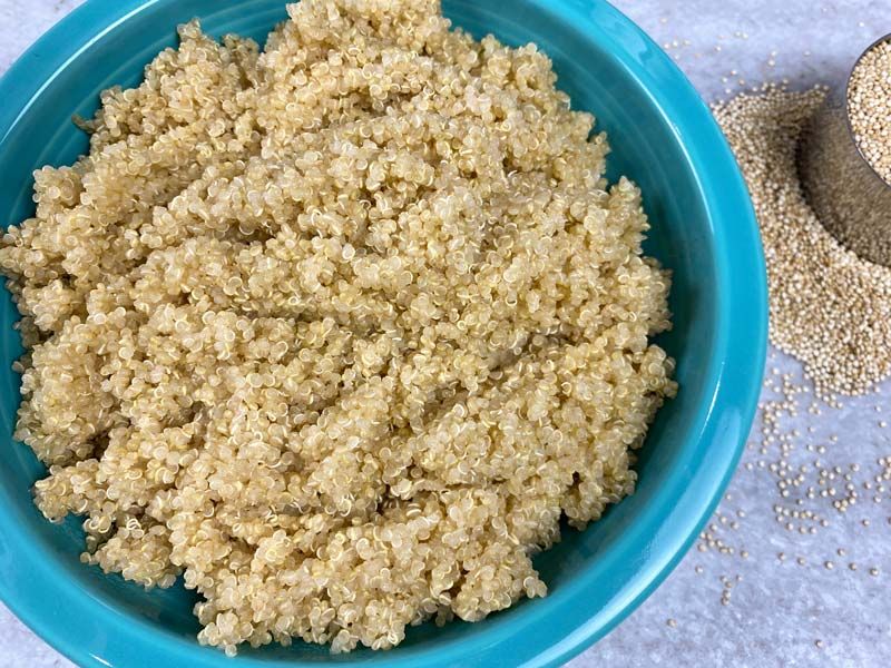 Cooked quinoa in a blue bowl