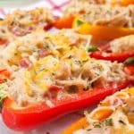 Red and yellow mini peppers cut length-wise and stuffed with a cheesy, chicken and bacon filling.