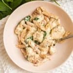 top down image of chicken pasta in a white bowl