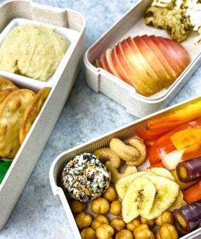 close up of vegetables and snacks in a charcuterie lunch box