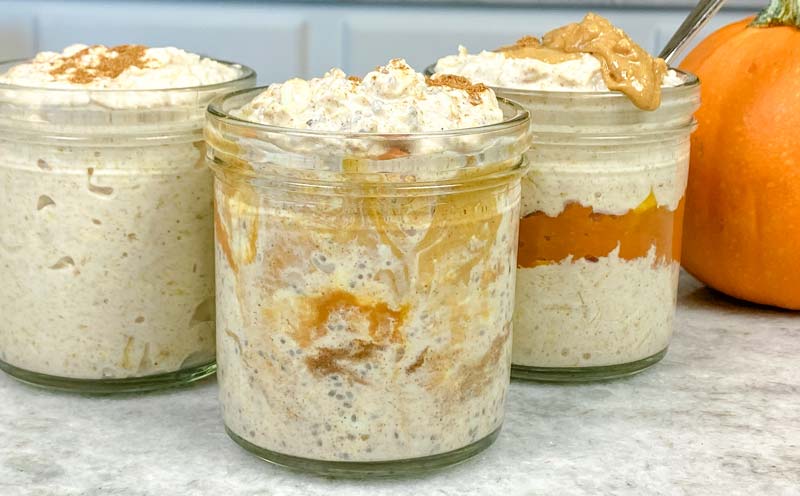 three jars of pumpkin overnight oats on counter