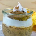 close up og pumpkin chia seed pudding layered with coconut whipped cream